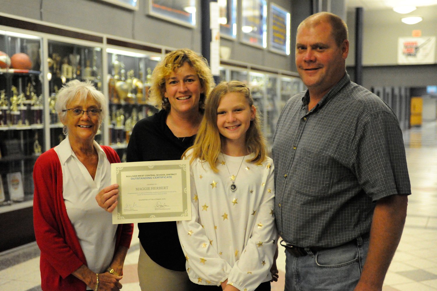 Maggie Herbert, not pictured, a Sullivan West graduate of the Class of 2020, was recognized for her “outstanding academic performance” at the Sullivan West Board of Education meeting on August 27. As she is attending SUNY Morrisville, her family accepted the certificate on her behalf: grandmother Kathy Herbert, left, mother Katie Herbert, sister Ella Herbert and father Joe Herbert.